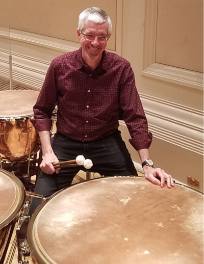 Duncan Patton sits by timpani