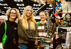 PAS members pose near percussion instruments at PASIC.